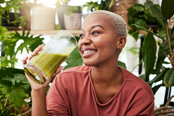 Black woman, healthy and green smoothie with nutrition for detox or smile with wellness in home....