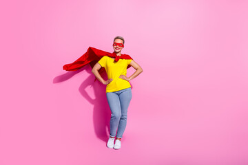 Full length portrait of nice cheerful person put hands waist wear superhero suit empty space isolated on pink color background