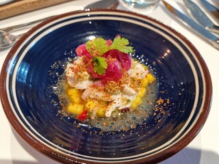 colorful appetizer on blue plate on fine dining resturant