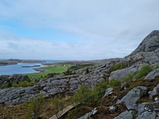 the wooden vega stairs leading up the mountain on the vega island with magificent ocean and island view. popular tourist attraction.