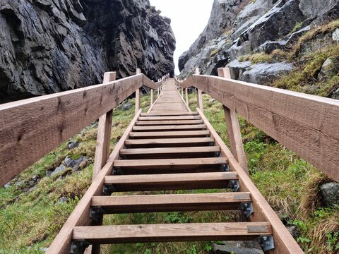 the wooden vega stairs leading up the mountain on the vega island with magificent ocean and island view. popular tourist attraction.