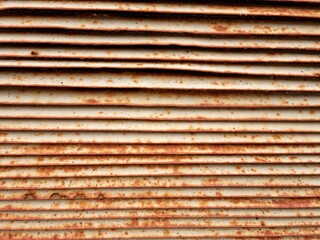 old rusted metal wall section on abandoned building