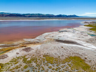Argentina: Puna - aerial view of the colorful Laguna Carachi Pampa, a surreal and beautiful landscape surrounded by volcanic rocks and dunes of sand
