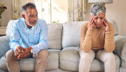 Senior couple, divorce and fight in conflict, argument or disagreement on living room sofa at home....