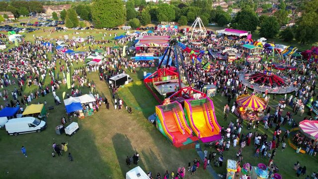 High Angle Footage of Public Funfair Held at Lewsey Public Park of Luton with Free Access for Muslim Community on Islamic Holy Eid Festival Day. Captured with Drone's Camera on June 29th, 2023