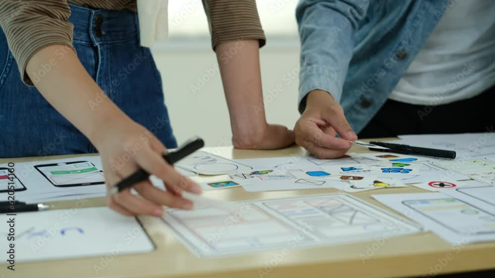 Wall mural mobile application, user and development. team of designer brainstorming for mobile app interface wi