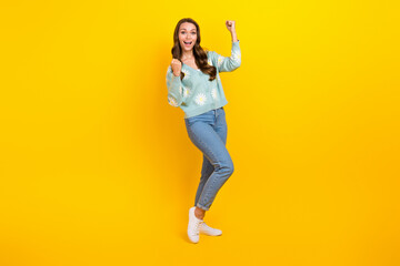 Fototapeta na wymiar Full body photo of young adorable woman stylish outfit celebrate black friday sale shopping day fists up advert isolated on yellow color background