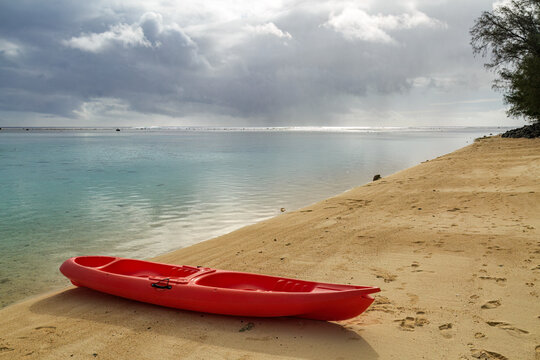 A kayak on the golden sands of Aroa Beach, Rarotonga, Cook Island