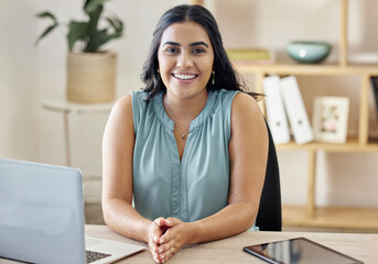 Technology, portrait of a happy businesswoman and laptop at her desk in a modern workplace office. Internet or digital connectivity, administration or research and cheerful female seo manager