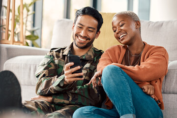 Army man, interracial couple and return with phone meme at home with laugh and video streaming. Lounge, young people and mobile scroll together in a house sitting on a lounge ground with soldier