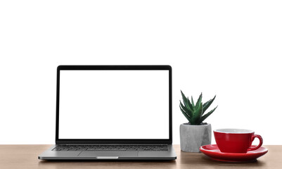 Fototapeta premium New laptop with blank screen, cup of drink and potted plant on table against white background