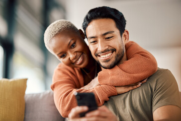 Phone, interracial couple and technology on a sofa at home reading text in a living room. Support,...