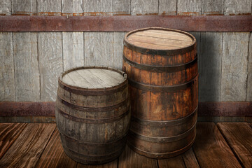 Wooden barrels on brown surface near textured wall