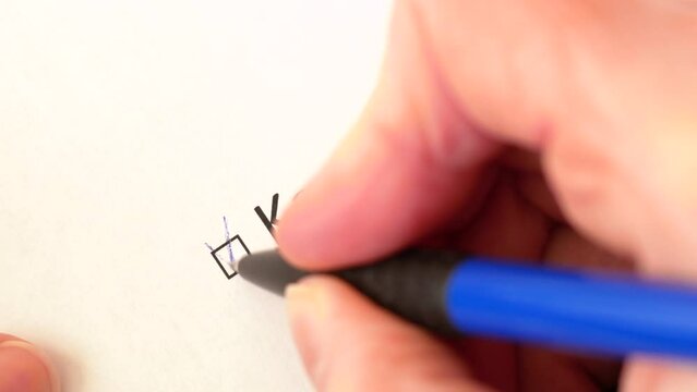 Hand daw in the questionnaire. A closeup of female hand answering about using kanban methodology in software development process question marking in a checkbox