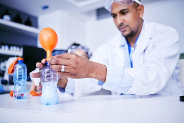 Chemistry, balloon and father with child in laboratory for medical research, science and education. Healthcare, family and scientist dad with girl do experiment for knowledge, learning and teaching