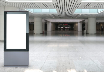 Beautiful blank advertising billboard at airport, train station. White panel for mockup. Copy space...