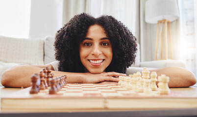 Chess, game and portrait of woman with board for strategy, thinking and challenge at home....