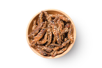 Crispy fish (anchovy) in wooden bowl isolated on white background with clipping path, top view, flat lay.