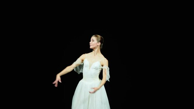 Ballet, graceful ballerina in a white tutu dance and perform choreographic elements on a black background, beautiful dramatic dance, 4k slow motion.