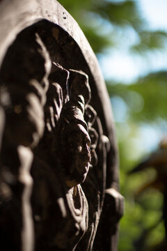 Main focus is the Muragala (watchtower). A plant and a sky can be seen in the blurred background.