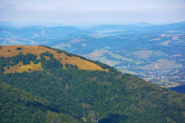 mountainous landscape in late summer. rolling hills in yellow and orange colors. beautiful nature background on a sunny afternoon
