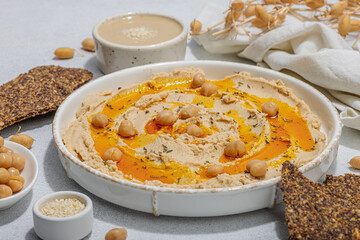 Hummus with olive oil, crispy bread. Indispensable for healthy lifestyle. Comfort food, vegan snack