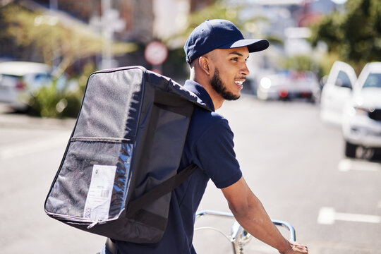 Man, bicycle and delivery in city with bag of logistics, distribution service and fast food order. Courier, eco friendly transport or deliveryman travel on bike with ecommerce product in urban street
