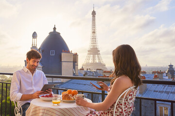 Travel, breakfast and couple in Paris with the Eiffel Tower on a terrace for romance or...