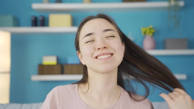 Close-up portrait of funny and beautiful Asian young woman.