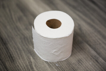 roll of toilet paper on a clean, white background, symbolizing comfort, hygiene, and the everyday essentials of modern life