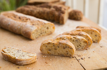 fresh loaf of bread on wooden board