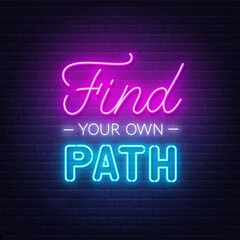 Find Your Own Path neon lettering on brick wall background.