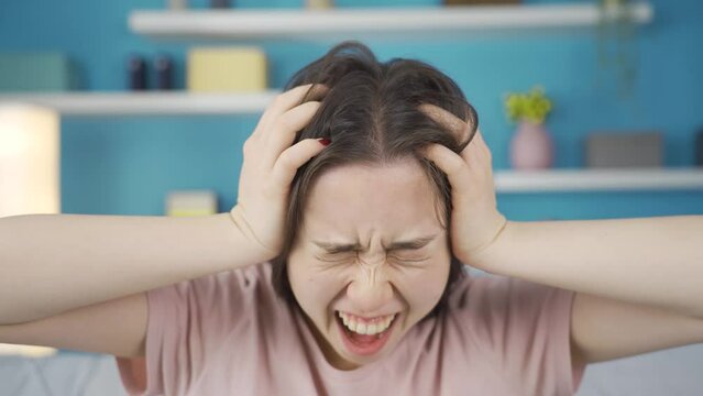 Close-up portrait of Asian woman having nervous breakdown.