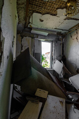 inside a destroyed house without people in an abandoned city in Ukraine