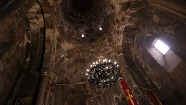 GEGHARD, ARMENIA - JUNE 6, 2023: Inside Geghard Temple. Interior of famous Geghard Monastery and church carved into rock