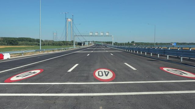 Wide angle 4K video with the suspension bridge in Braila, Romania. The third longest suspended bridge in Europe. Infrastructure industry in Romania.