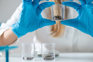 Medical innovation as a scientist meticulously prepares fecal transplant caps in the lab. Witness...