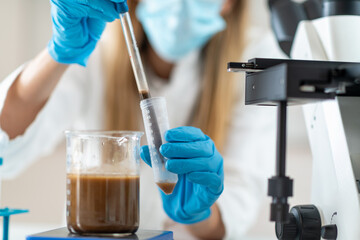 Fototapeta premium The groundbreaking process of preparing fecal transplant liquid in the lab. This technique holds immense potential for treating various gut-related conditions. 