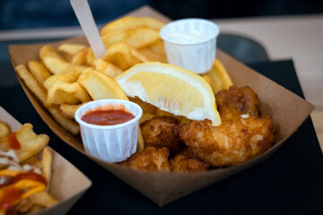 french fries and chicken wings with ketchup and mayonnaise dip