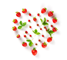 Berries and leaves of strawberries in the shape of a heart on a white background.