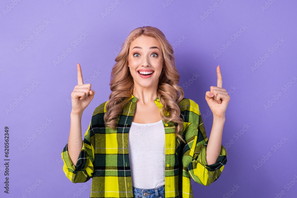 Sticker Photo funny amazed girl promoter showing novelty product empty space wear checkered shirt isolated pastel color purple background