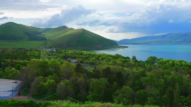 Fantastic evening panorama of alpine Lake Sevan in Armenia. Panoramic view of mountain lake in front of mountain range, national parks of Armenia .
