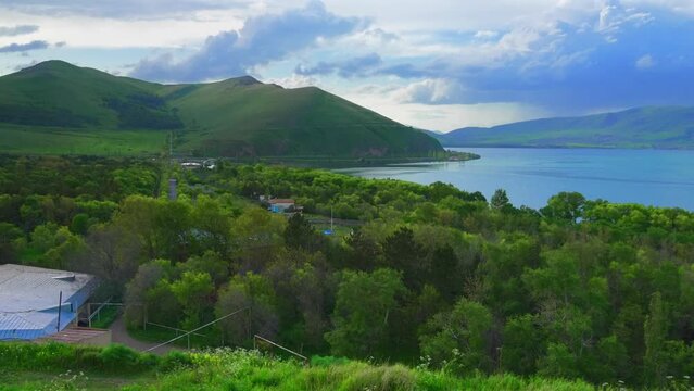 Fantastic evening panorama of alpine Lake Sevan in Armenia. Panoramic view of mountain lake in front of mountain range, national parks of Armenia .
