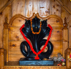 June 28th, 2023, Nagthat, Uttarakhand, India. Hindu Deity Nag Devta or the Serpent God black stone...