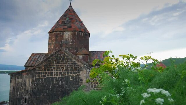 Scenic view of old Sevanavank church in Sevan, Armenia on sunny blue sky day. Sevanavank monastery complex on peninsula on northwestern shore of Lake Sevan in Armenia