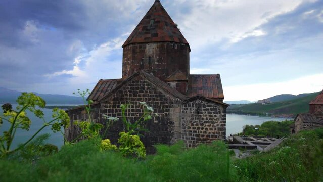 Scenic view of old Sevanavank church in Sevan, Armenia on sunny blue sky day. Sevanavank monastery complex on peninsula on northwestern shore of Lake Sevan in Armenia