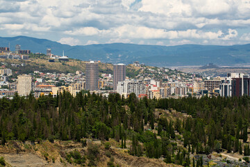 Saburtalo Vake district in Tbilisi, Georgia on a sunny summer day with beautiful clouds.	