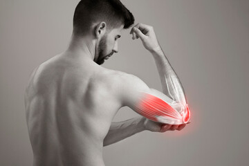 A man's grip on his painful elbow, human arm pain