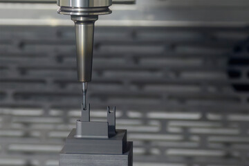 The CNC milling machine finish cutting the graphite electrode parts with solid ball end mill.