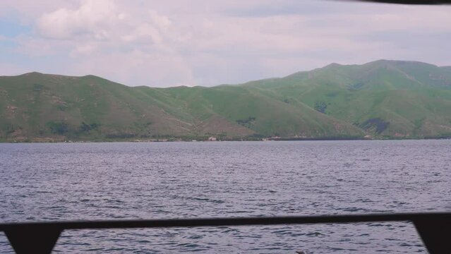 Fantastic evening panorama of alpine Lake Sevan in Armenia. Panoramic view of mountain lake in front of mountain range, national parks of Armenia .